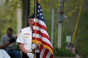 Veteran holding an American flag.